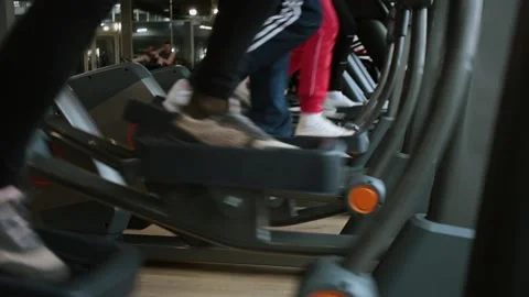 Legs doing a cardio training on the elliptical machine in the gym. Stock Footage 145542040