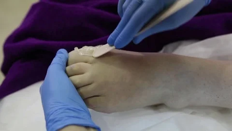 Legs epilation process with sugar mass. Master of shugaring at work Stock Footage 82960145