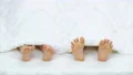 The legs exercise with legs on the bed. view from above 4k or 4k+ Resolution