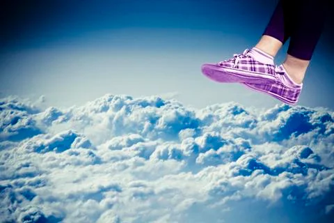Legs of female over clouds 库存插图