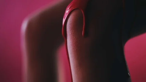 On the legs flow red paint Stock Footage 81701389