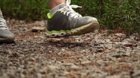 Legs go on a mountain path. close-up. slow motion 動画素材 99258298