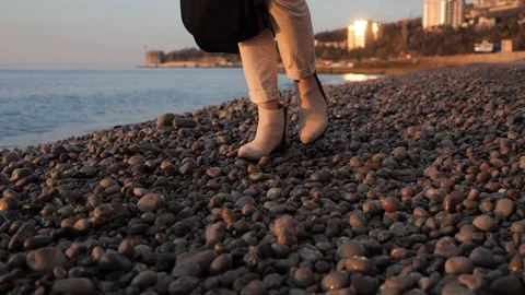 Legs go on pebbles Stock Footage 106342864