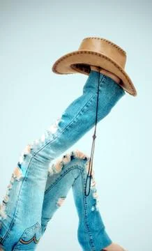 Legs with hat on background Stock Photos