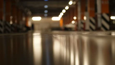Legs in heels go from left to right on the parking among the cars 4K Slow Mo Видео 100430246