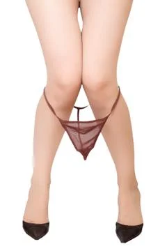 Legs in high hells shoes with string panties Stock Photos