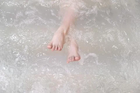 Legs in jacuzzi. Stock Photos