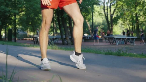 Legs of jogger warming up before running Video stock 158381133