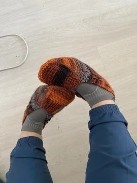 Legs with Knitted Socks Close-Up Stock Photos