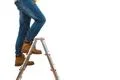 The legs on the ladder on the white background Photo