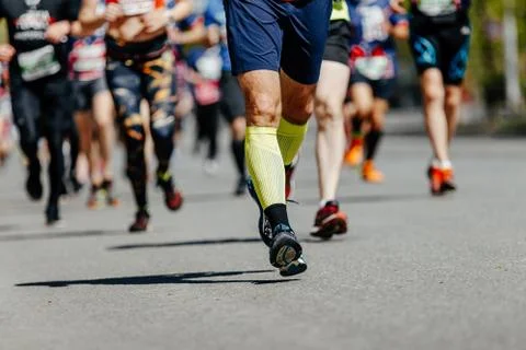 Legs male runner in compression socks Stock Photos