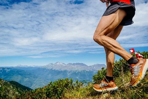 Legs male runner run down mountain race Stock Photos