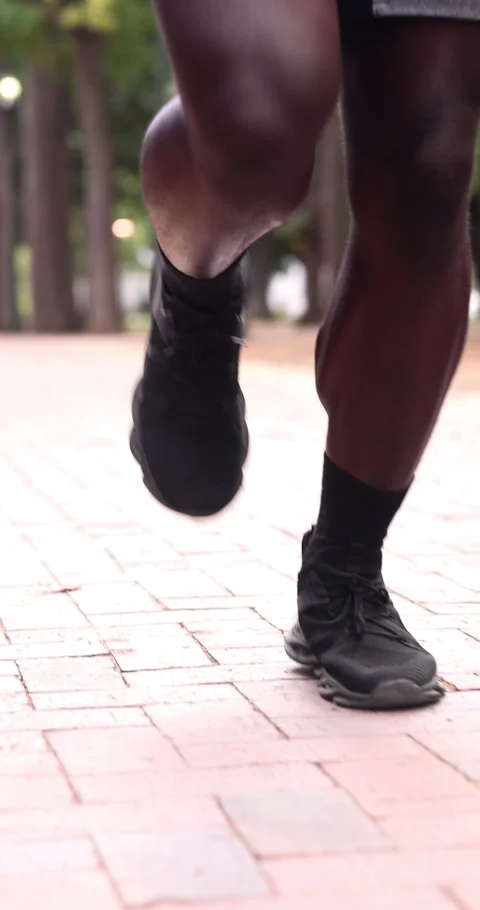 Legs, man and running at park for fitness, exercise and cardio training for Stock Footage 340791200