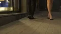 Legs of man and woman walking towards camera, couple going to club, night out HD Footage