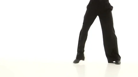 Legs of man dancing elements of latino in white studio Stock Footage 75507787