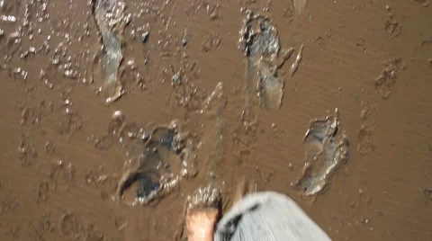 Legs of a man going through the mud Stock Footage 44354261