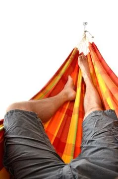Legs of man lying down in bright hammock isolated on white background Stock Photos