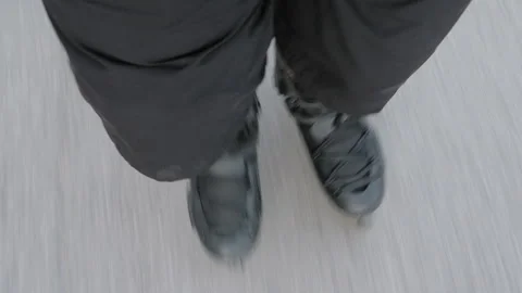 Legs of a man rollerblading on the street. High angle view Stock Footage 263498479