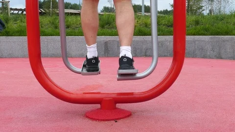 Legs of a man on a running simulator | Stock Video | Pond5
