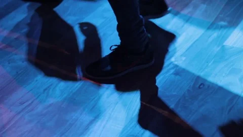 Legs of Men dancing with Nikes shoes at Night Club Stock Footage