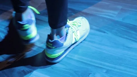 Legs of Men dancing using New Balance shoes at Night Club Stock Footage 79165660