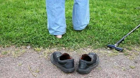 The legs of an old man goes out barefoot on the grass Stock Footage 24772298