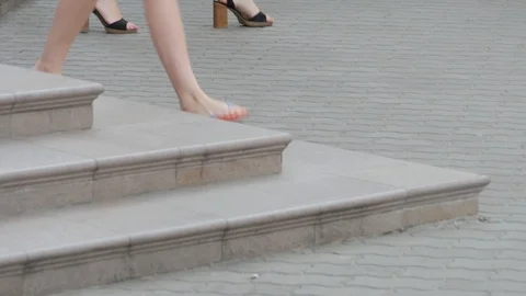 Legs of pedestrians on the sidewalk. Loop Stock Footage 113188398