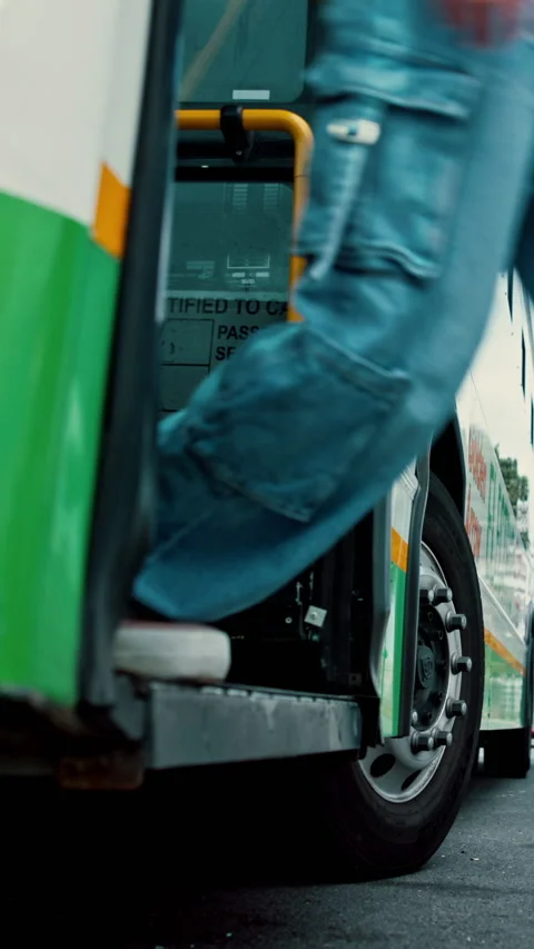 Legs, people and exit bus in city for travel arrival, drop off location and Video stock 335283540