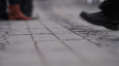 Legs of people walking through the downtown market rush paved with cubical 01 Stock Footage 59556387