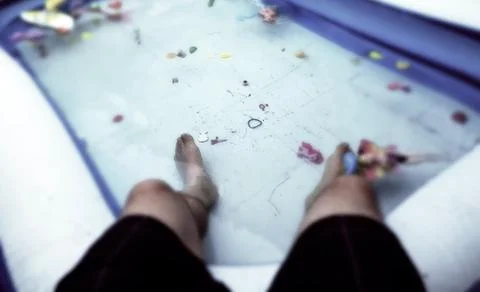 Legs in the pool Stock Photos