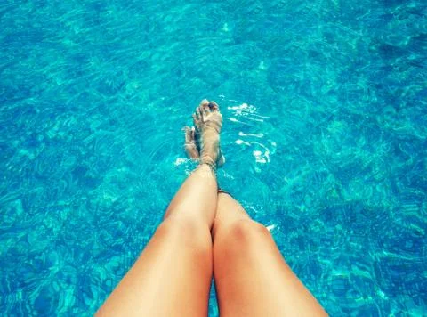 Legs in the pool Stock Photos