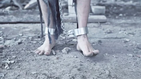 The legs of the prisoner in chains closeup Video stock 76357978