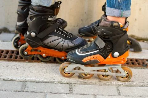 Legs in rollerblades. Stock Photos