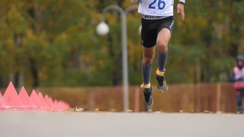 Legs of the Runner on Asphalt Stock Footage 111879917