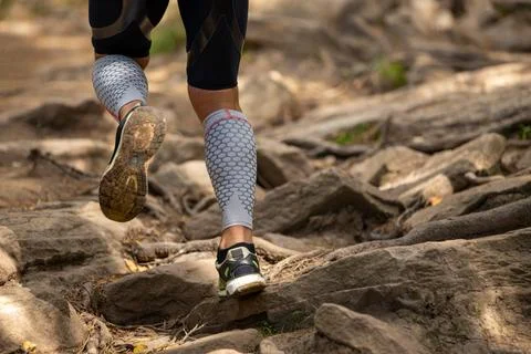 Legs runner in compression sleeves Stock Photos
