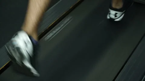 Legs of a running athlete on a treadmill Stock Footage 92159557