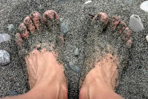 Legs in sand Stock Photos
