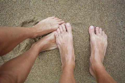 Legs on the sand Stock Photos