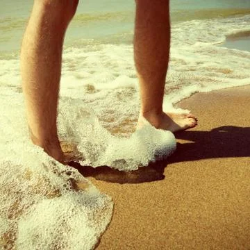 Legs on the Seashore Stock Photos