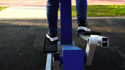 Legs on the simulator in the park Stock Footage 151029367