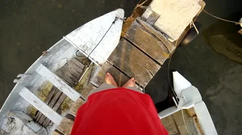 Legs spinning on the dock Stock Footage 12563001