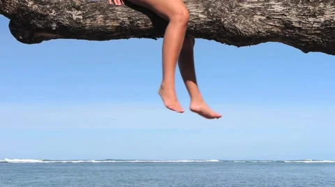Legs Swinging from a Tree Stock Footage 1034935