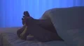 The legs under a cover on the bed. night time 4k or 4k+ Resolution