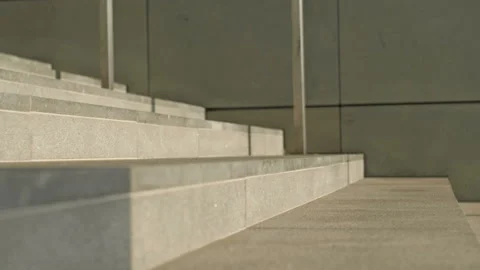 Legs of various people running down the stairs of an underpass or subway during Stock Footage 200186952