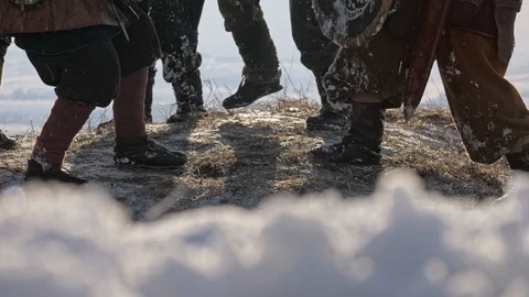 Legs of Viking Warriors, during attack at winter time. Medieval Reenactment. Stock Footage