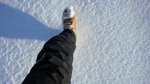 Legs walk through snow Stock Footage 72747529