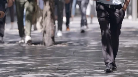Legs walking on a pavement Stock Footage 165291716