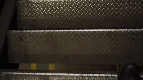 The legs of a walking worker, a first-person view of the stairs. Stock Footage 178480298