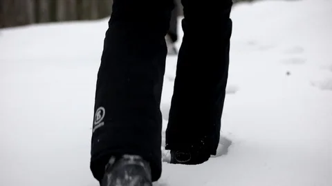 Legs in Winter Boots Making a Pass Through Thick Snow. Close up on Shoes. Stock Footage 71795885