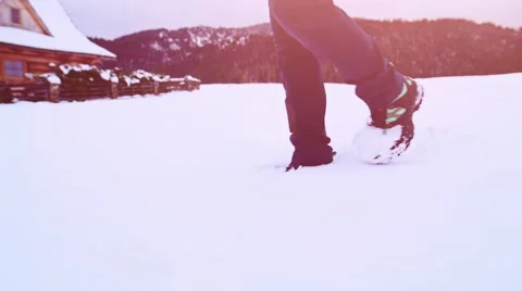 Legs in Winter Boots Walking through Thick Snow. STABILIZED SLOW MOTION 120fps. Stock Footage 68827769